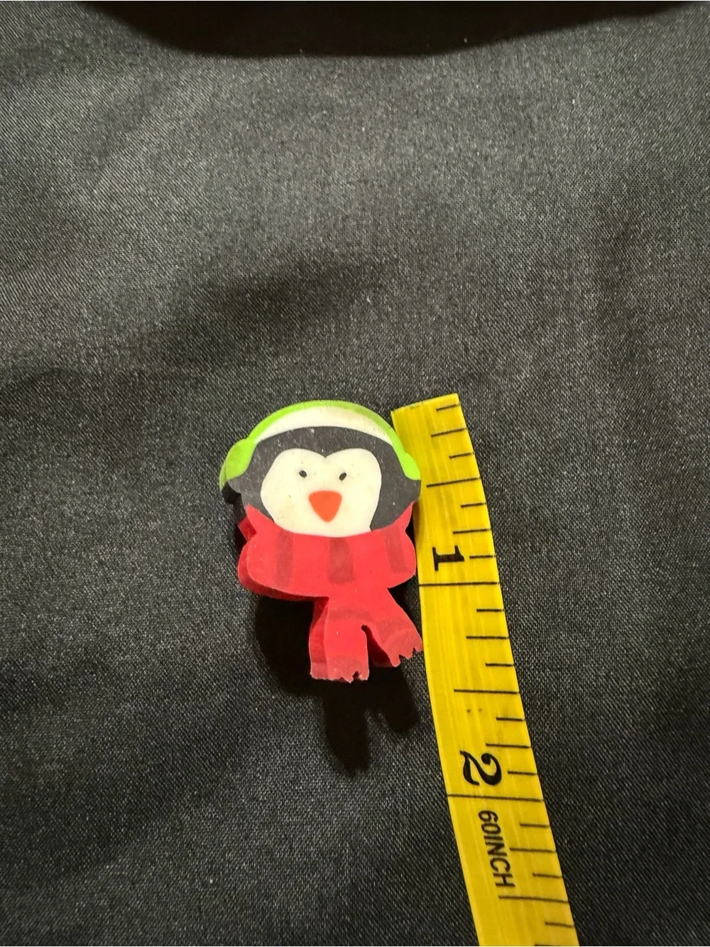 Source Unknown Penguin Eraser Pin with Green Headphones and Red Scarf